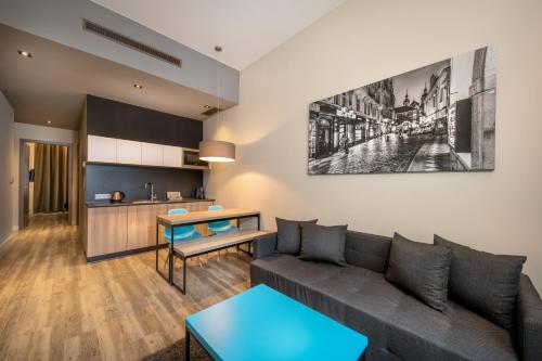 a living room with a couch and a table at Avenue Legerova 19 in Prague
