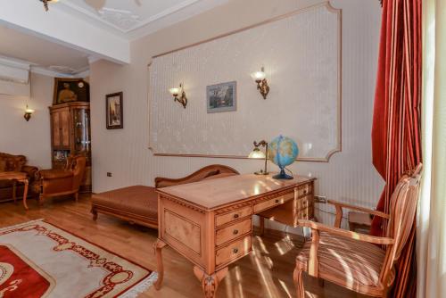 a living room with a desk and a couch at Aristocratic Sofia Studio Apartment Next to Cathedral in Sofia