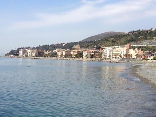 a city on the shore of a body of water at Hotel La Torre in Cogoleto