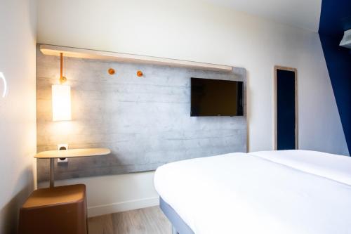 Letto o letti in una camera di ibis budget Paris Gennevilliers
