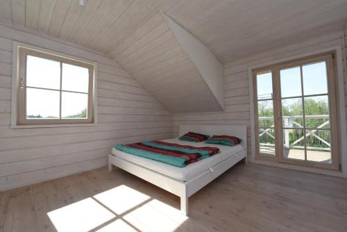 Katil atau katil-katil dalam bilik di Sodybos kompleksas - ECO Resort Trakai