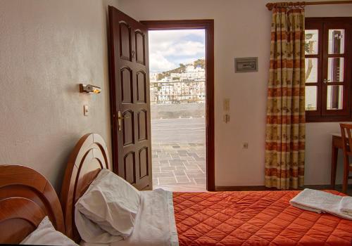 Postel nebo postele na pokoji v ubytování Hotel Lofos - The Hill