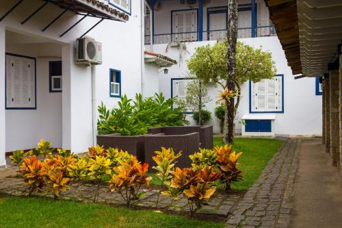 Ein Garten an der Unterkunft Pousada Aconchego