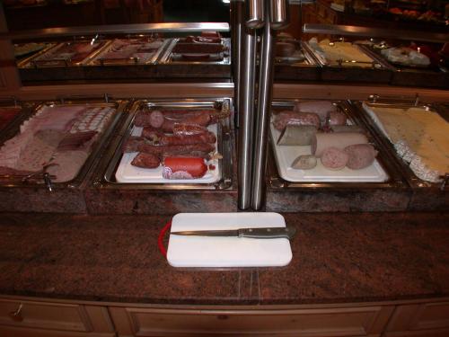 a counter with two trays of food in an oven at Hotel Mühlenberg in Bad Sachsa