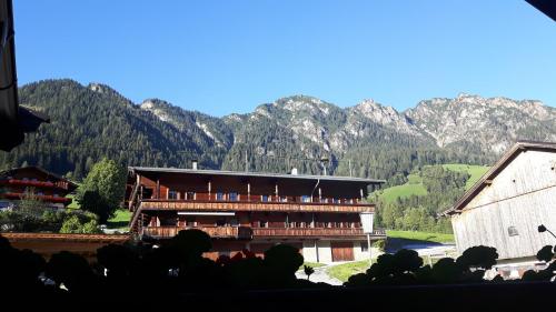 a view of a building with mountains in the background at Haus Schmetterling in Alpbach