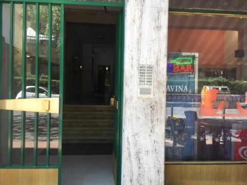 a door to a store with a sign in the window at Appartamento Natalia Verona in Verona