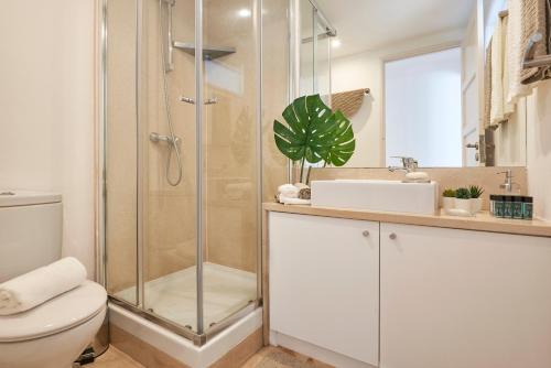 a bathroom with a shower and a toilet and a sink at Casa Portuguesa Chiado in Lisbon