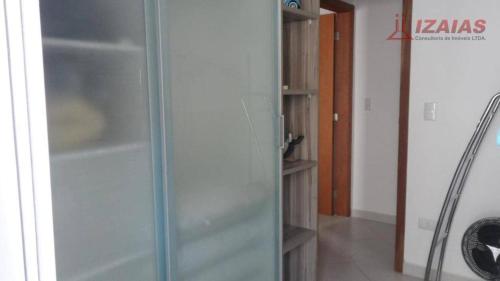 a glass door of a shower in a room at apartamento pra que mais in Ubatuba