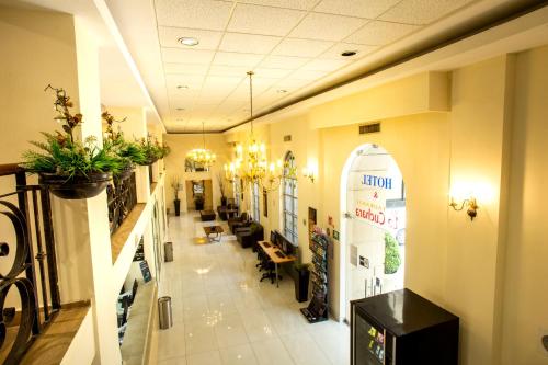 a lobby of a store with plants on the walls at Best Western Centro Monterrey in Monterrey