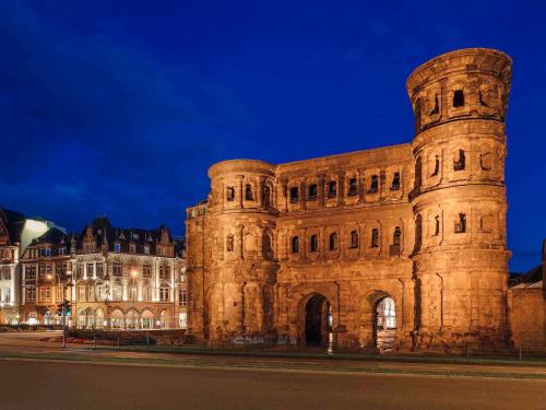 a large stone building at night at Holiday Home Amélie in Bollendorf