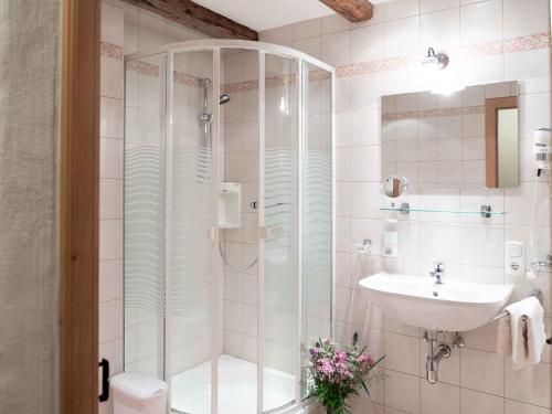 a bathroom with a shower and a sink at Landhaus Strickenmacher in Sillian