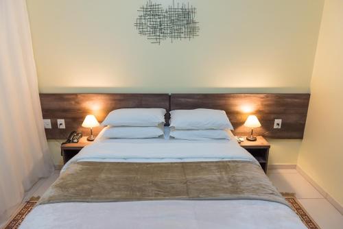 Voodi või voodid majutusasutuse Hotel D'Nápoles toas