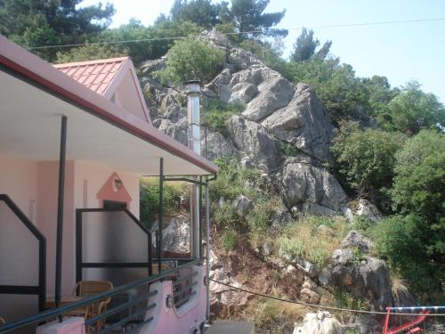 a house with a view of a mountain at Apolis hotel in Mouzákion