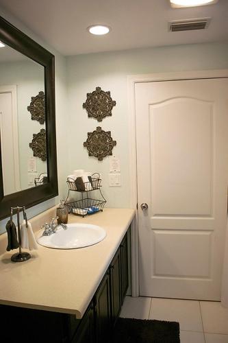 a bathroom with a sink and a mirror at Winter Park charm in Orlando