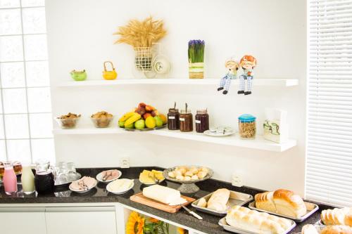 a kitchen counter with a bunch of food on it at Hotel Rio Fortuna in Rio Fortuna