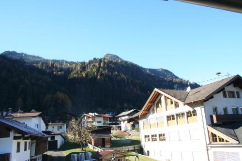 a view of a town with a mountain in the background at Ferienwohnung Spindlegger in Schlitters
