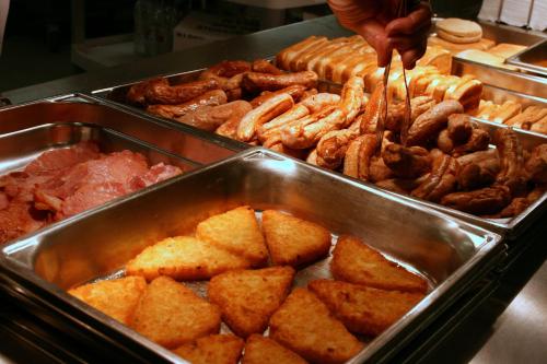 a buffet filled with different types of food in trays at Black Rock Inn in Blackwater