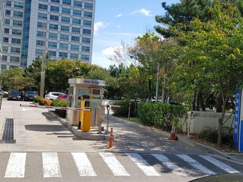 a gas station on the side of a city street at Sky Guestel in Incheon
