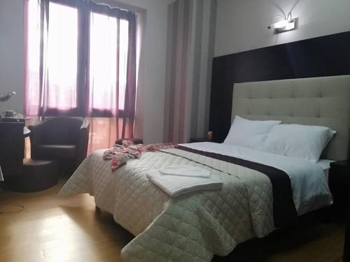 Ένα ή περισσότερα κρεβάτια σε δωμάτιο στο CityHome Aparthotel