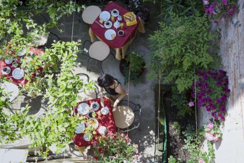 an overhead view of a woman sitting at a table at Locanda Gaffaro in Venice