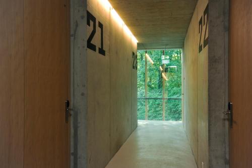a hallway with a door with the number on the wall at Basel Youth Hostel in Basel
