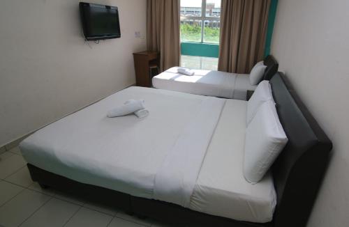 Katil atau katil-katil dalam bilik di Venice Inn