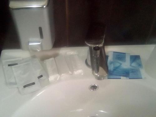 a bathroom sink with a faucet on a sink at Vershnyk in Cherkasy