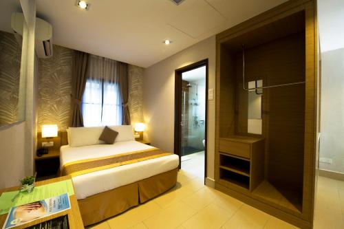 Krevet ili kreveti u jedinici u objektu De Palma Resort Kuala Selangor