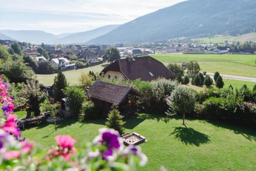 an aerial view of a house in a green field at Appartement Haus Moser in Sankt Michael im Lungau