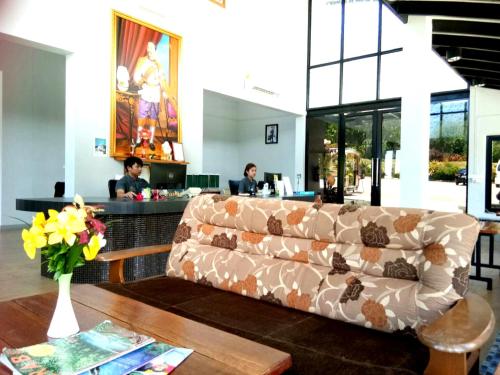 a living room with a couch and a table at Arawan Krabi Beach Resort in Ao Nam Mao