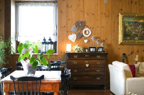 a dining room with a table and a dresser at Albergo Stelvio in Bormio