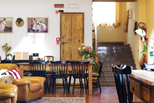 a dining room with a table and chairs at Albergo Stelvio in Bormio
