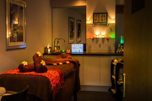 a room with two beds and a counter in a kitchen at Parkway Hotel & Spa in Newport