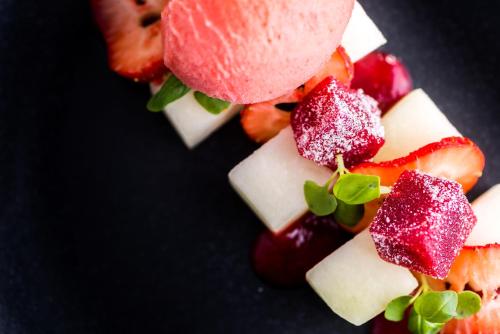 a bunch of fruit on a black plate at Parkway Hotel & Spa in Newport