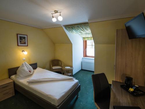 מיטה או מיטות בחדר ב-Kutscherklause