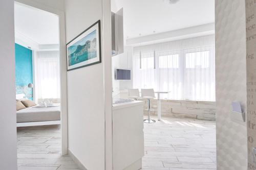 Una cama o camas en una habitación de Luxury Experience | WelcHome Napoli