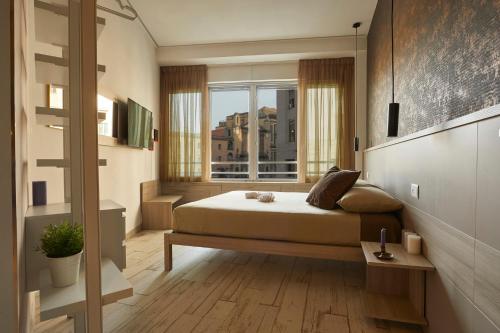 Una cama o camas en una habitación de Luxury Experience | WelcHome Napoli