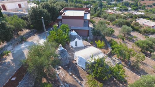 an aerial view of a house with a church at Villa Anna in Selva di Fasano