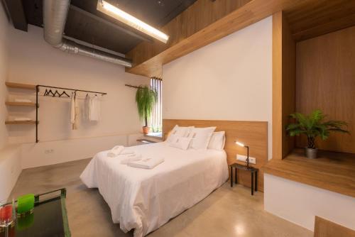 מיטה או מיטות בחדר ב-Petit Luxe Loft