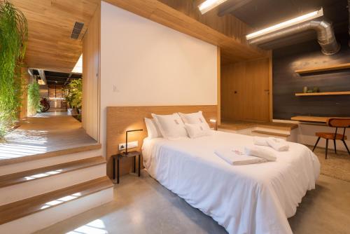 Katil atau katil-katil dalam bilik di Petit Luxe Loft