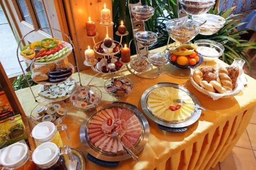 a table with a bunch of food on it at Pension Wolfsegg in Kirchberg in Tirol