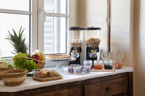 a table with food and other foods on it at B&B Magnolia in Cannobio