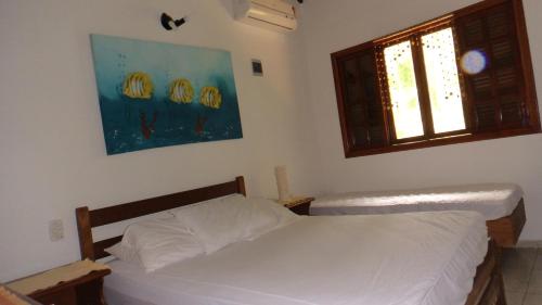 Ένα ή περισσότερα κρεβάτια σε δωμάτιο στο CASA CONDOMÍNIO FECHADO