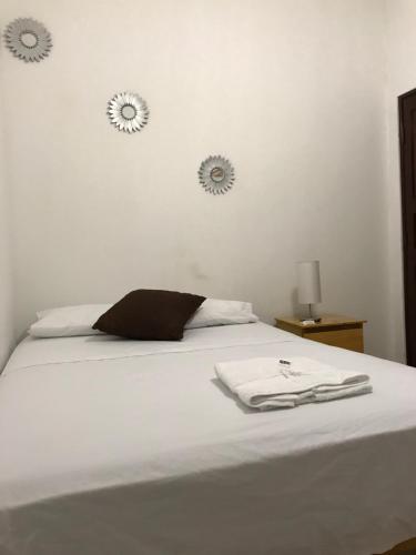 Postel nebo postele na pokoji v ubytování Hotel Tumpis