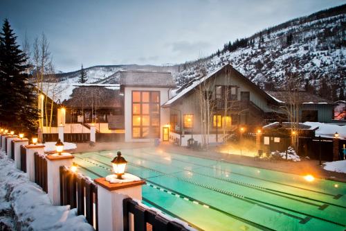 a swimming pool with lights in the snow at Vail Racquet Club Mountain Resort in Vail