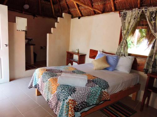 Una cama o camas en una habitación de Veleando Ando Cabañas