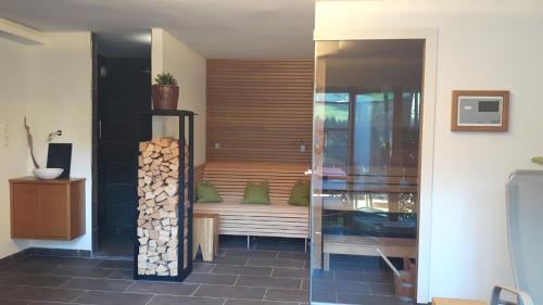 a room with a bench with a pile of wood at Haus Schmetterling in Alpbach