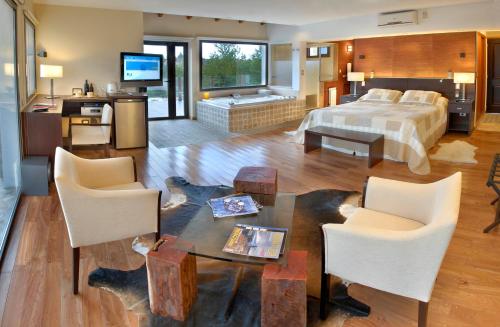 Ένα ή περισσότερα κρεβάτια σε δωμάτιο στο Suites de la Colina