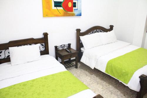 Hotel Colonial Manizalesにあるベッド