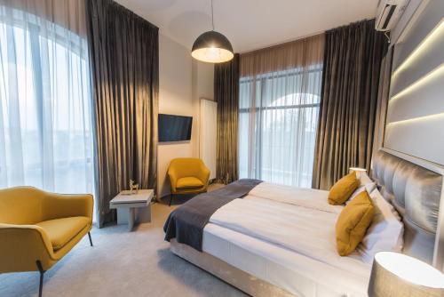 Ένα ή περισσότερα κρεβάτια σε δωμάτιο στο Hotel Edma